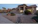 House exterior with a covered entryway and rock landscaping at 9439 E Palm Tree Dr, Scottsdale, AZ 85255