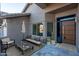 Inviting front porch with modern seating and landscaping at 9439 E Palm Tree Dr, Scottsdale, AZ 85255