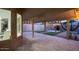 Covered patio with view of backyard and pergola at 9439 E Palm Tree Dr, Scottsdale, AZ 85255