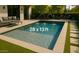Inviting 28 x 13 ft pool featuring deck jets, in-pool lounge, and adjacent patio with ample seating at 9439 E Palm Tree Dr, Scottsdale, AZ 85255