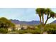 Beautiful Arizona mountain views enhance this front yard with its lush green landscaping at 9439 E Palm Tree Dr, Scottsdale, AZ 85255