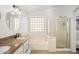 Bright bathroom with double sink vanity, shower, and tub at 9970 E Monte Cristo Ave, Scottsdale, AZ 85260