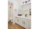 Modern bathroom with white vanity, black fixtures, and a shower-tub combo at 9970 E Monte Cristo Ave, Scottsdale, AZ 85260