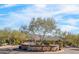 Scenic view of the entrance to Horseman's Park featuring desert landscaping, a stone sign, and mountain backdrop at 9970 E Monte Cristo Ave, Scottsdale, AZ 85260