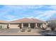 Charming single-story home featuring a tile roof, desert landscaping, and a welcoming front porch area at 9970 E Monte Cristo Ave, Scottsdale, AZ 85260