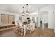 Bright, all white eat-in kitchen with pendant lights and stainless steel appliances at 9970 E Monte Cristo Ave, Scottsdale, AZ 85260