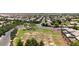 Wide aerial view of community, showing neighborhood and park at 10325 W Windsor Ave, Avondale, AZ 85392