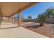 Covered patio with desert landscaping, ideal for outdoor relaxation at 10325 W Windsor Ave, Avondale, AZ 85392