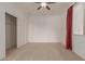 Bright bedroom with ceiling fan and large closet at 10325 W Windsor Ave, Avondale, AZ 85392