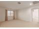 Well-lit bedroom with window and carpet at 10325 W Windsor Ave, Avondale, AZ 85392