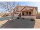 Two-story house with a three-car garage and covered porch at 10325 W Windsor Ave, Avondale, AZ 85392