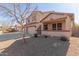 Two-story house with a three-car garage and covered porch at 10325 W Windsor Ave, Avondale, AZ 85392