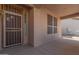 Covered front porch with a security door and window screens at 10325 W Windsor Ave, Avondale, AZ 85392