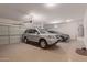 Spacious two-car garage with ample storage shelving and room for two SUVs at 10325 W Windsor Ave, Avondale, AZ 85392