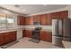 Bright kitchen with stainless steel appliances and wood cabinets at 10325 W Windsor Ave, Avondale, AZ 85392