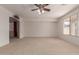 Bright and airy living room with neutral carpeting at 10325 W Windsor Ave, Avondale, AZ 85392