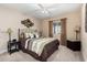 Bedroom with queen-size bed and ceiling fan at 10334 W Sunbird Dr, Arizona City, AZ 85123