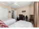 Bedroom with two twin beds, a desk and ceiling fan at 10334 W Sunbird Dr, Arizona City, AZ 85123