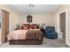 Spacious bedroom with king-size bed and en-suite bathroom at 10334 W Sunbird Dr, Arizona City, AZ 85123