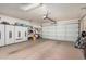 Garage with storage cabinets and overhead door at 10334 W Sunbird Dr, Arizona City, AZ 85123