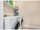 Laundry room with washer, dryer, and shelving for storage at 10334 W Sunbird Dr, Arizona City, AZ 85123