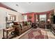 Living room featuring brown leather furniture and a large-screen TV at 10334 W Sunbird Dr, Arizona City, AZ 85123