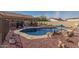 Sparkling blue kidney shaped pool in backyard at 10334 W Sunbird Dr, Arizona City, AZ 85123