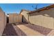 Tan colored storage shed with double doors at 10334 W Sunbird Dr, Arizona City, AZ 85123