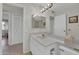 Bathroom with vanity, toilet, and view of closet at 10722 W Loma Blanca Dr, Sun City, AZ 85351