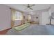 Bedroom featuring a queen bed, wood floors, and ceiling fan at 10722 W Loma Blanca Dr, Sun City, AZ 85351