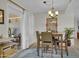 Dining area with wood table and chairs, access to patio at 10722 W Loma Blanca Dr, Sun City, AZ 85351