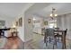 Kitchen and dining area with hardwood floors and a table for four at 10722 W Loma Blanca Dr, Sun City, AZ 85351