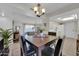 Dining area with a wood table, chairs, and kitchen view at 10722 W Loma Blanca Dr, Sun City, AZ 85351