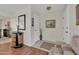 Entryway with wood floors and a decorative console table at 10722 W Loma Blanca Dr, Sun City, AZ 85351