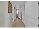 Clean hallway with tile floors and linen closets at 10722 W Loma Blanca Dr, Sun City, AZ 85351