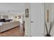 View of a living room with hardwood floors and a white door at 10722 W Loma Blanca Dr, Sun City, AZ 85351