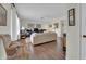 Bright living room with hardwood floors and comfy seating at 10722 W Loma Blanca Dr, Sun City, AZ 85351