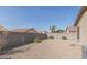 Backyard view of house with gravel and block wall at 11261 E Quarry Ave, Mesa, AZ 85212