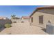 Backyard view of house with gravel and block wall at 11261 E Quarry Ave, Mesa, AZ 85212