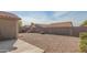 Landscaped backyard with gravel and block wall at 11261 E Quarry Ave, Mesa, AZ 85212