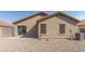 Backyard view of house with gravel and block wall at 11261 E Quarry Ave, Mesa, AZ 85212