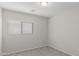 Simple bedroom with neutral walls and carpet flooring at 11261 E Quarry Ave, Mesa, AZ 85212