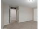 Well-lit bedroom with access to hallway and additional rooms at 11261 E Quarry Ave, Mesa, AZ 85212