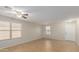 Bright living room with tile floor and window blinds at 11261 E Quarry Ave, Mesa, AZ 85212