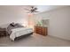 Cozy bedroom with a double bed, dresser, and ceiling fan at 12012 N Saguaro Blvd # 6, Fountain Hills, AZ 85268