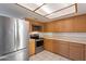 Stainless steel appliances and wood cabinets are featured in this kitchen at 12012 N Saguaro Blvd # 6, Fountain Hills, AZ 85268