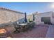 Outdoor patio with brick paving, table, chairs, and umbrellas at 12012 N Saguaro Blvd # 6, Fountain Hills, AZ 85268