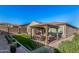 Backyard features a pergola, grass, and a paved patio area at 12064 S 186Th Ave, Goodyear, AZ 85338