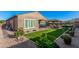 Landscaped backyard with artificial turf and patio cover at 12064 S 186Th Ave, Goodyear, AZ 85338