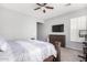 Bright bedroom with wood bed frame and plenty of natural light at 12064 S 186Th Ave, Goodyear, AZ 85338